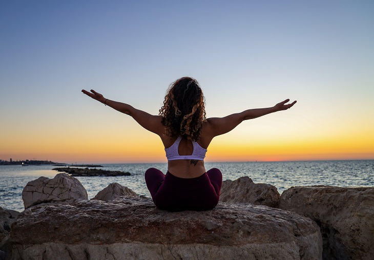 woman meditating - immune-boosting activities