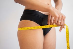person measuring body fat percentage