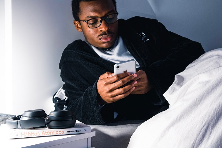 man using phone before bed